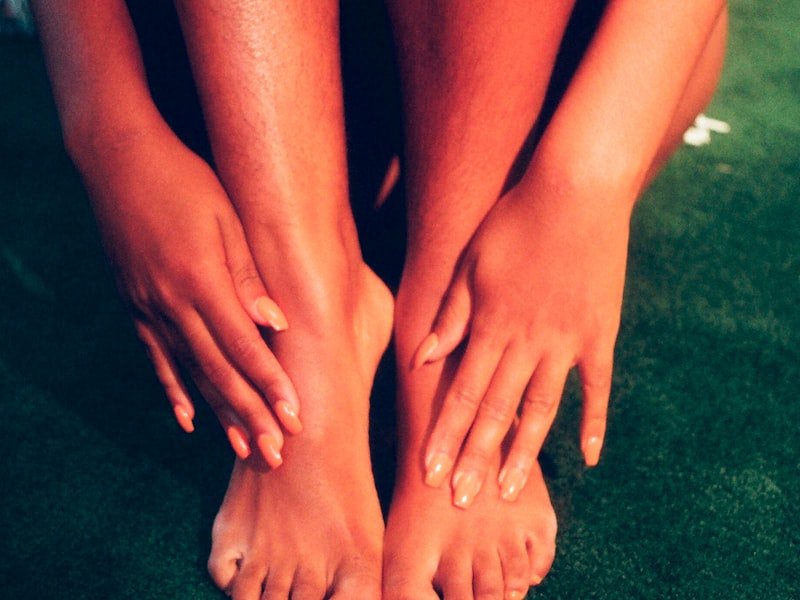 Bare feet resting calmly, warmly lit